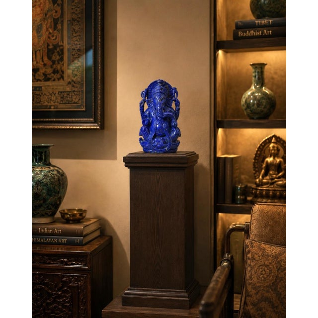 An exceptional carving of Ganesha in the finest AAAAA grade natural lapis lazuli, distinguished by its intense, saturated...