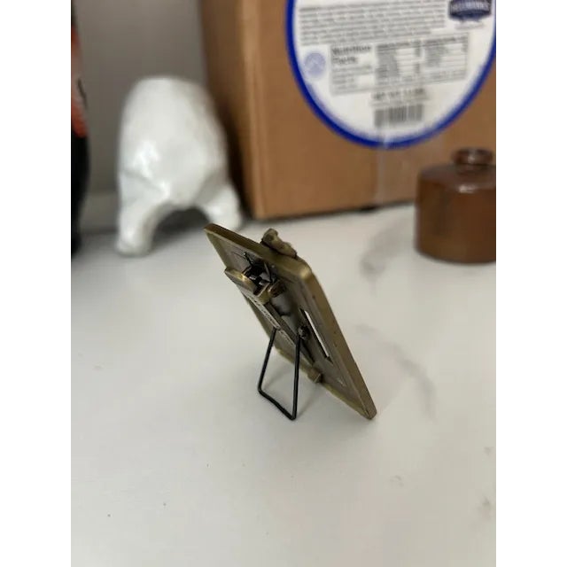 Mini picture frame with clip (pictured) by Neiman Marcus. Frame features a beautiful butterfly design and marbled...