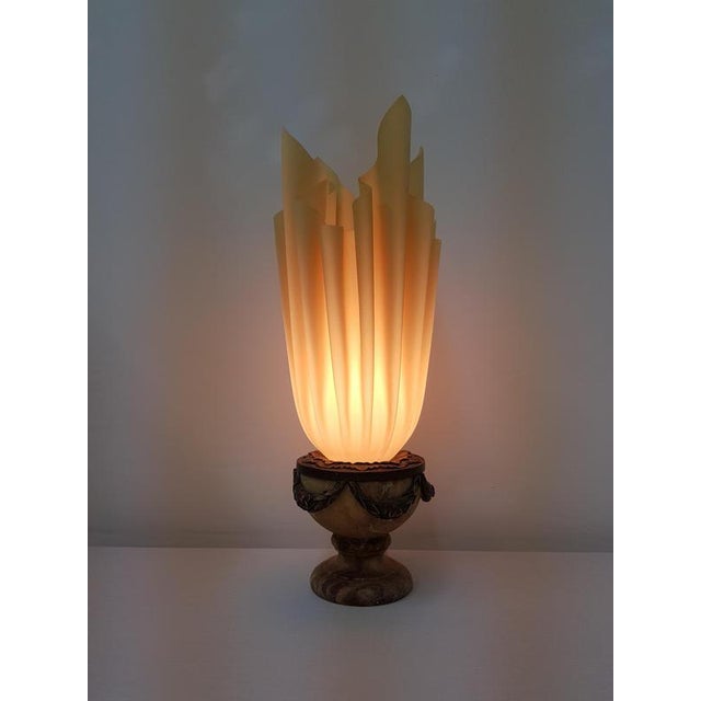 Typical lamp by Georgia Jacob, rare model with special marble base, with the well-known torch-shaped shade made of acrylic...