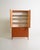 Two-piece teak wardrobe with four hinged doors. Scandinavian production, 1960s. Featuring balanced proportions and a...