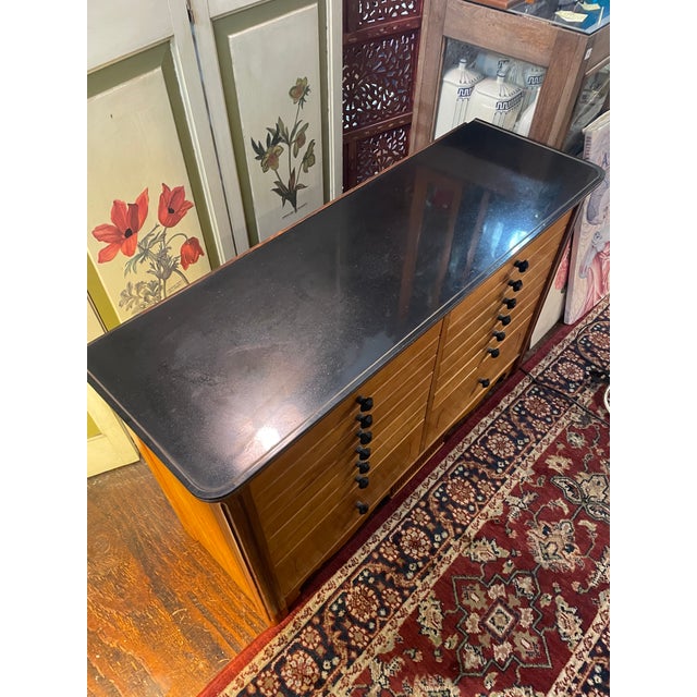 This is a classic floor-standing medical storage cabinet from the early-mid 20th century ('20s-'40s). Fine hardwood...