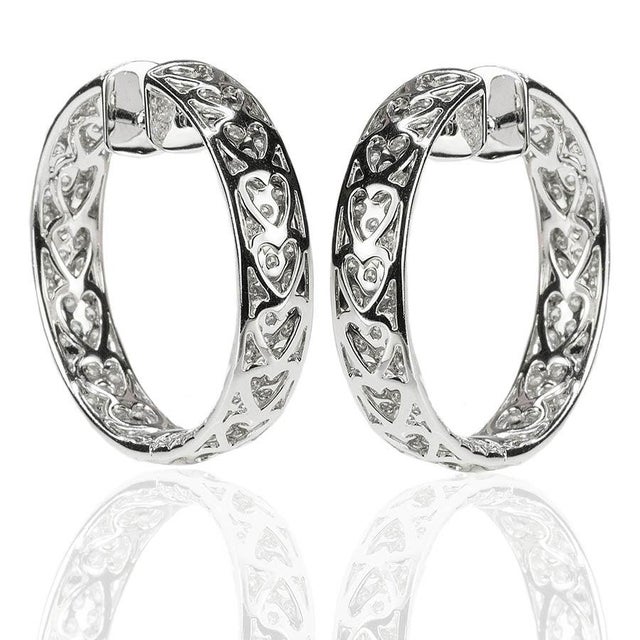 18k White gold inside/out hoop earrings with 8.07 carats of pave set round brilliant diamonds, 30.24 grams