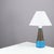 Table lamp made of partly blue-glazed stoneware with relief pattern. Signed “HAK" & "Denmark” on the bottom. Signature...