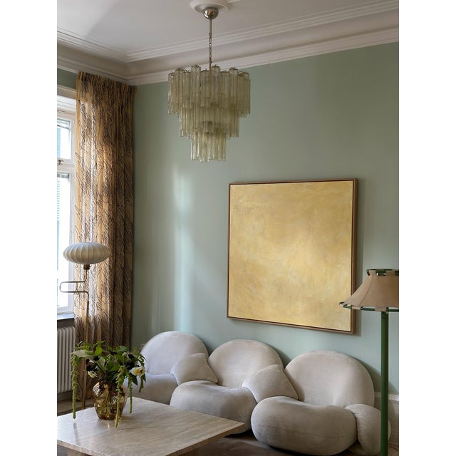 Elegant, colorful amber colored contemporary murano chandelier. Tubular tronchi formed glass prisms in traditional italian...