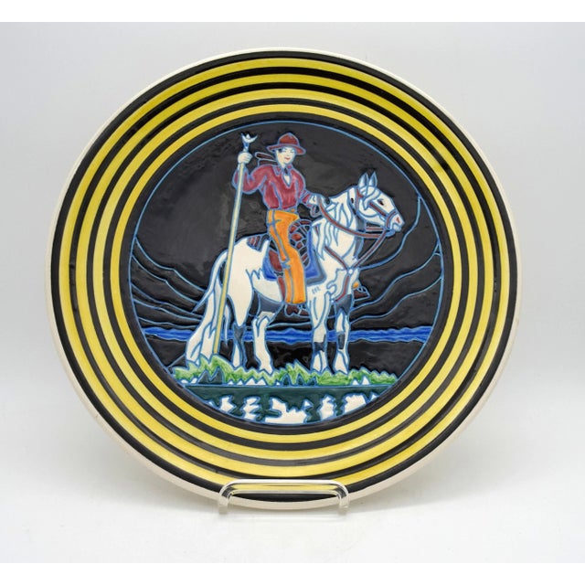 Magnificent plate, created by the artist Etienne Laget (born in 1896) and marked 'Faïence Folklorique' to identify his...