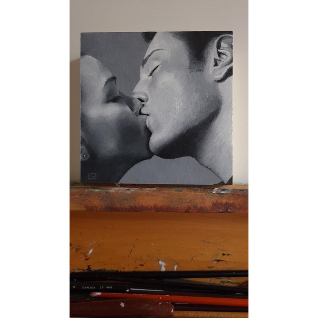 This intimate oil painting captures a tender moment between two figures, their faces softly merging in a kiss. Rendered in...