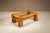 Some furniture speaks through ornament; other pieces rely entirely on craftsmanship. This coffee table, most likely...