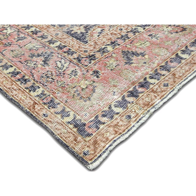 This Vintage Turkish Oushak Rug adds a vibrant touch to any home with its combination of wool and cotton. Measuring 7'4" x...