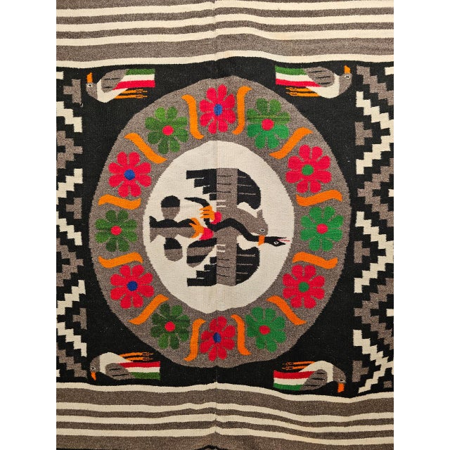 This striking late-20th-century Mexican Serape kilim is a compelling example of regional textile artistry, blending bold...