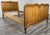 This Vintage French Louis single bed frame presents elegant traditional styling with softly shaped panels and warm oak...