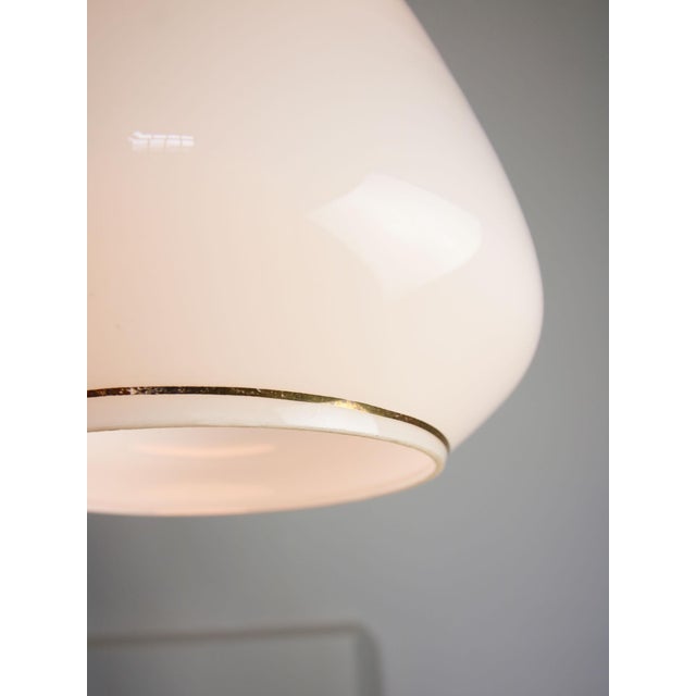 Lamp's cover is made of genuine brass material complementing this vintage item nicely with it's golden colour. total...