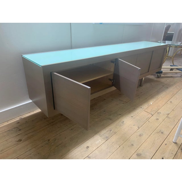 Charlie credenza by Brueton. Utilize the three compartments to easily access your dining, living or foyer goods. It is 19"...