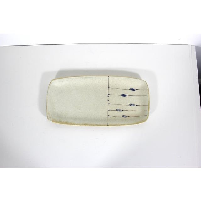 Vintage, signed, studio pottery platter or plate. Artist’s signature on the bottom. The base colour is a speckled creamy...