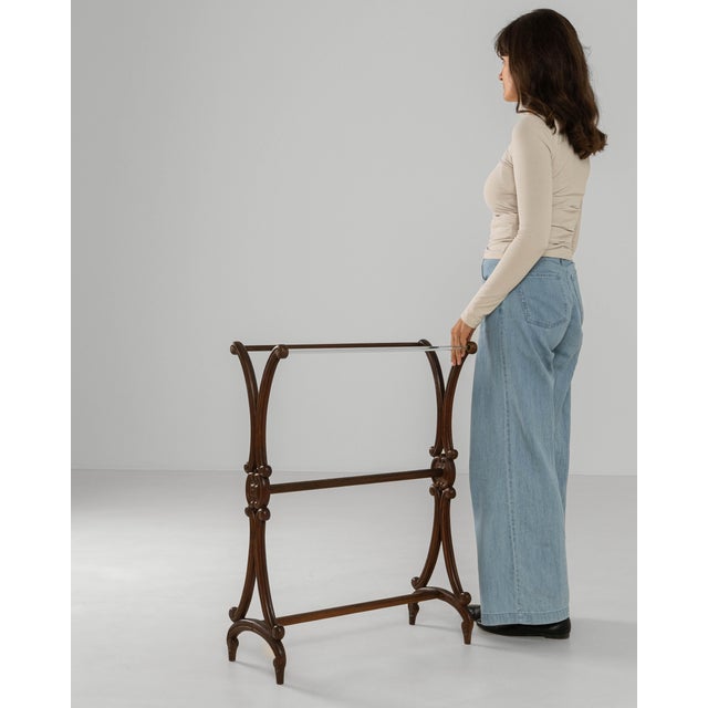 This early 1900s French wooden towel rack showcases graceful craftsmanship and understated decorative detail. Constructed...