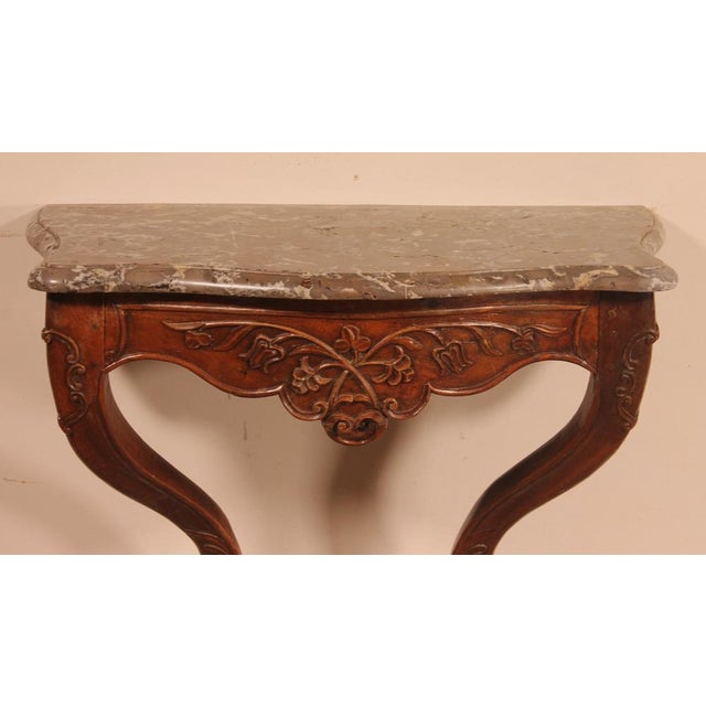 Lovely french walnut console from the 18th century Louis XV style from Lyon. Very beautiful molded and carved walnut...