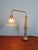 Large brass desk lamp on a wooden base with a clear, fluted glass shade, dating from approximately the 1930s. This unique...