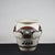 Terracotta vase painted with black and red graphic decorations on a white background. Production 1980 measures 43 x h 40...