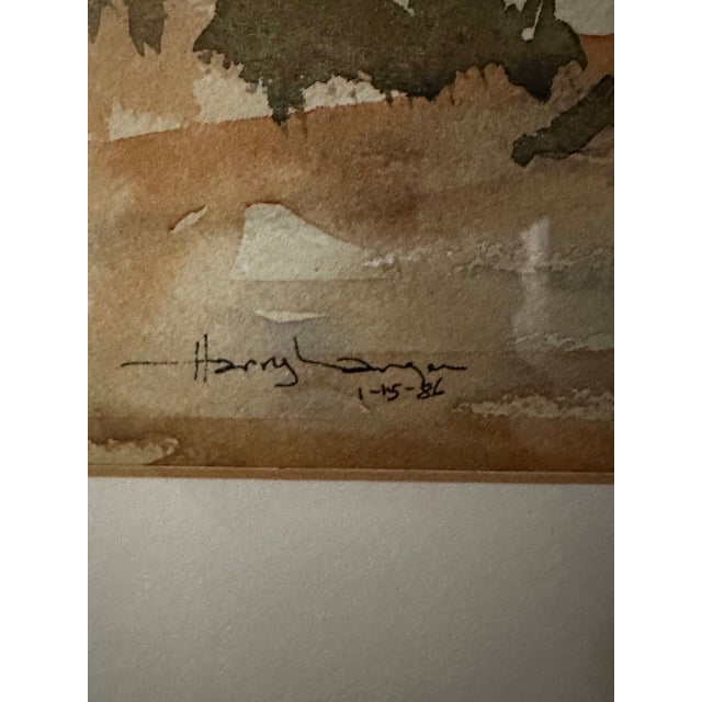 This classic watercolor of a house surrounded by trees is signed, but the artist’s last name is illegible. Painted in...
