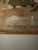 This classic watercolor of a house surrounded by trees is signed, but the artist’s last name is illegible. Painted in...