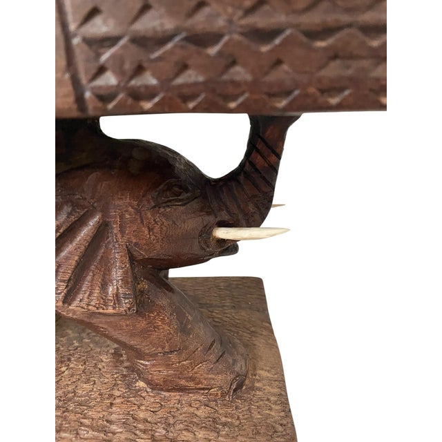 This VTG African Hand Carved Elephant Mancala Wooden Game Board is a unique and traditional piece of folk art. Handmade...