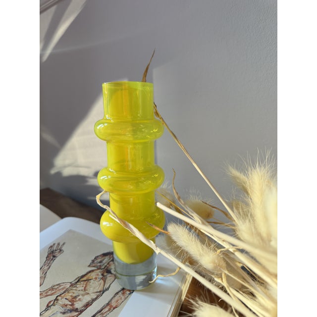 A mould-blown cased glass vase from the "Bamboo" range designed by Bo Borgström for Åseda Glasbruk in Sweden. The body is...