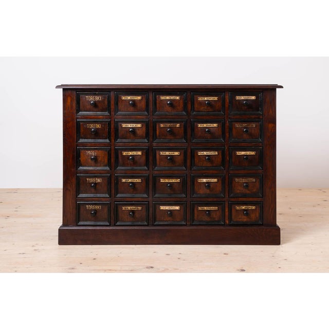 Rich in character and timeless craftsmanship, this exceptional Early 20th Century Apothecary Chest of Drawers embodies the...