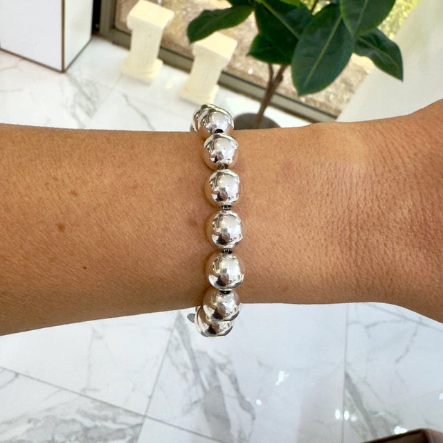 Brand: Tiffany & Co. Gender: Women's Metal Type: 925 Ball Bracelet Length: 7.00 inches Width: 10.00 mm Weight: 18.72...