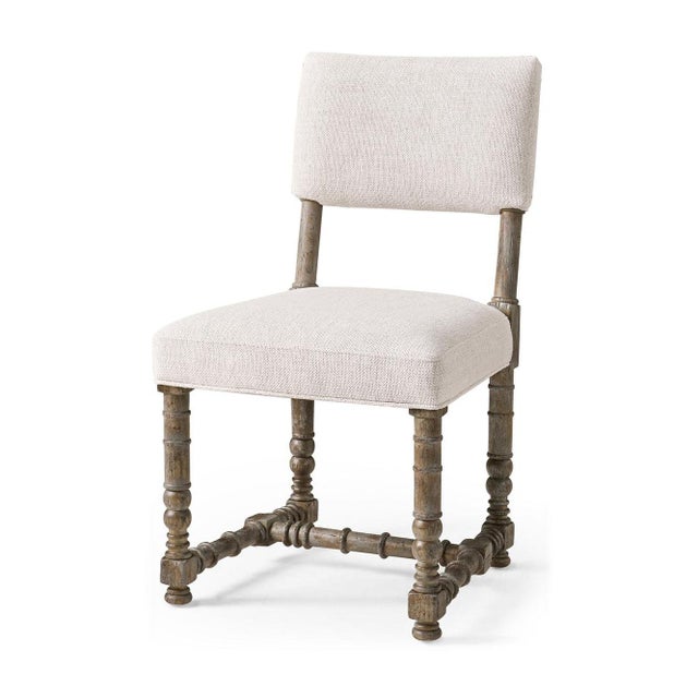 The chair brings together classic style and Spanish-inspired design. Its warm, greyed Dark Spain Painted Walnut finish...