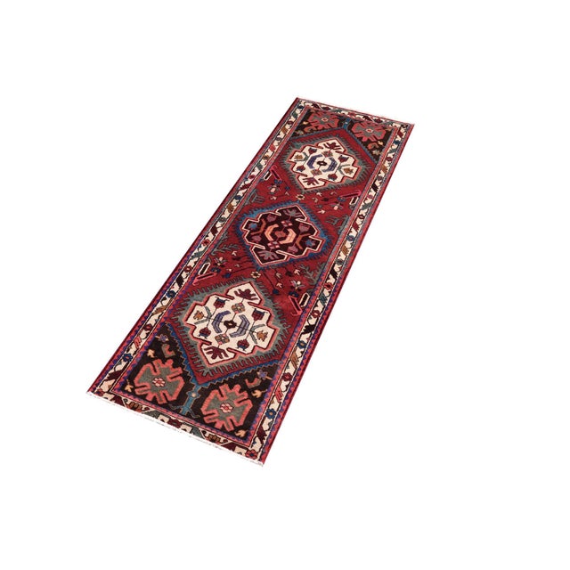 Hand knotted by skilled artisans from 100% wool and colored with all-natural vegetable dyes, this vintage antique-style...