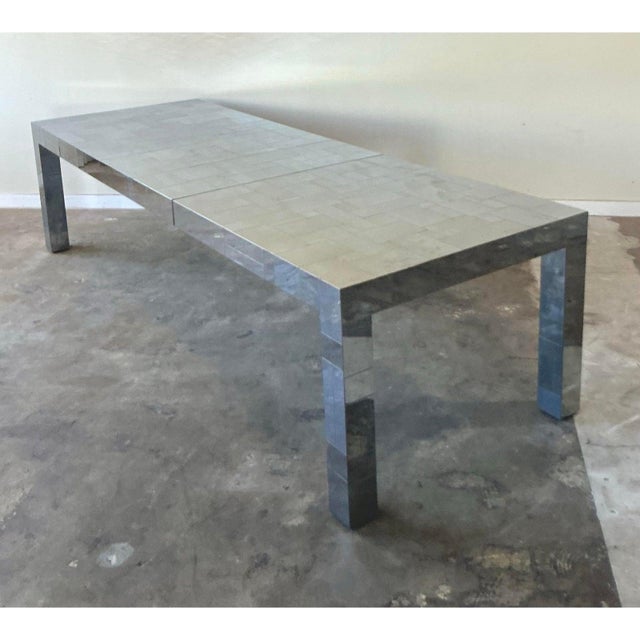 This spectacular vintage dining table embodies the high-octane glamour and futuristic aesthetic of the Hollywood Regency...