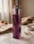 Cylindrical table lighter in amethyst-colored acrylic glass, a masterpiece of 1970s design by renowned Florentine artist...
