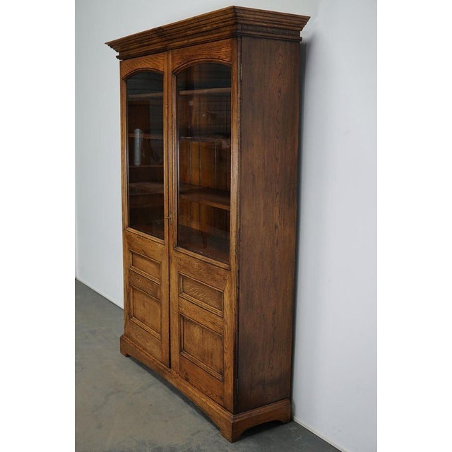 This bookcase was made from oak circa 1870s in England. It features two doors with a nice original key and lock. It...
