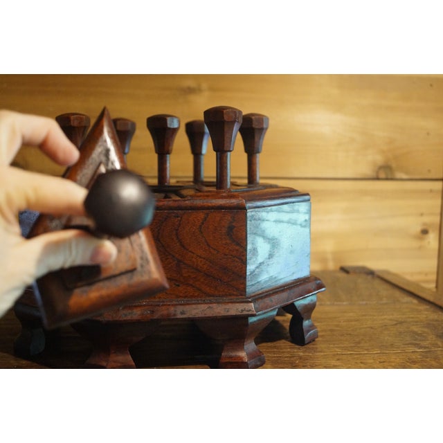 A very unusual Indian box which has segmented compartments and long handles on each compartment lid. This box is from the...