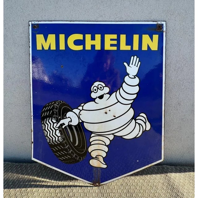 Double-sided 1970s Porcelain Michelin Tires Sign in authentic condition. Complete with intact mounting ears, it has superb...
