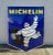 Double-sided 1970s Porcelain Michelin Tires Sign in authentic condition. Complete with intact mounting ears, it has superb...