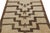 Hand-knotted in wool, this 4x4 vintage Tulu rug, circa 1950-1960, is among the family of Tulus with minimalist geometric...