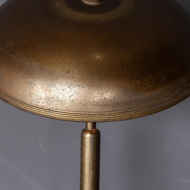Mid 20th century versatile bronze lamp with adjustable height and angle, featuring a sleek design attributed to giovanni...