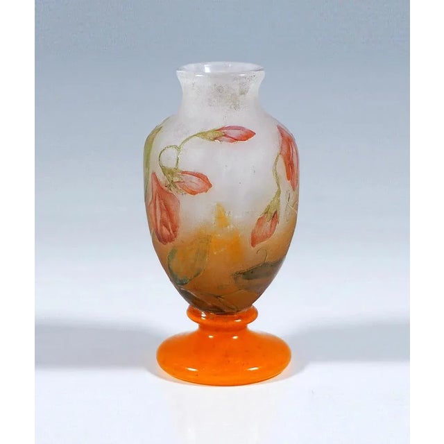 Exquisite French Art Nouveau Glass Craftsmanship: Small baluster vase with bulbous body on stepped round stand, with short...