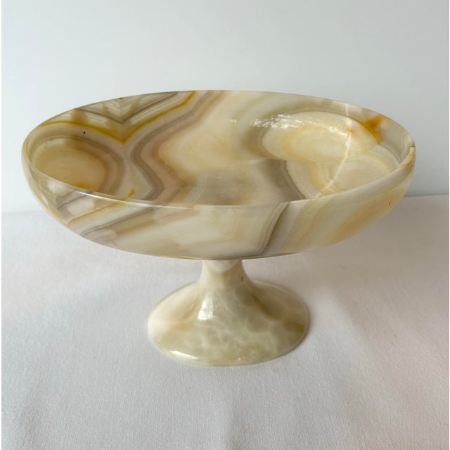 Vintage pedestal bowl made from heavy onyx that includes a variety of striations in lovely natural tones. A great...