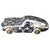 This silver Louis Vuitton paperweight shaped like a sports car is a modern and luxurious accessory that keeps stacks of...