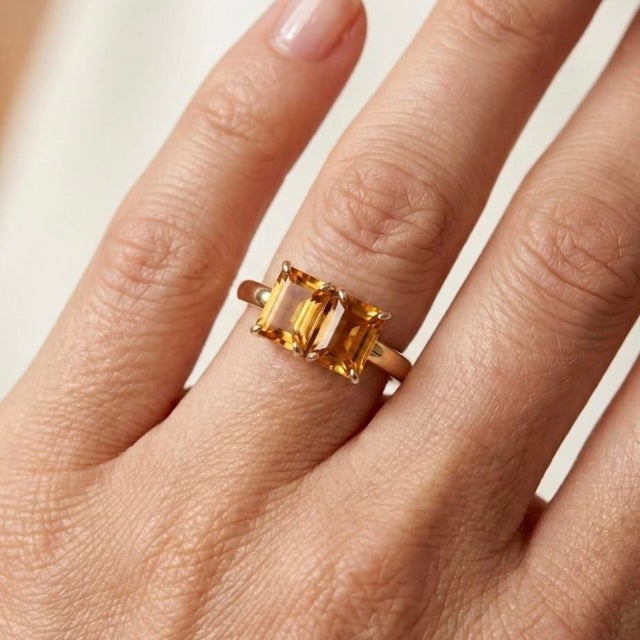 Warm, radiant, and bursting with golden energy, this exquisite Toi et Moi ("You and Me") ring features a parallel pair of...