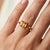 Warm, radiant, and bursting with golden energy, this exquisite Toi et Moi ("You and Me") ring features a parallel pair of...