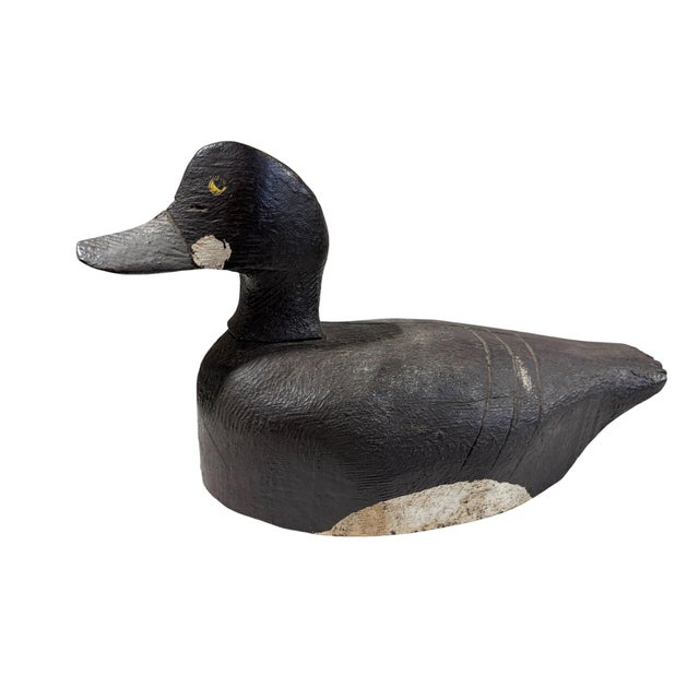 Old 20th century hand-carved and hand-painted solid wood duck decoy. This substantial piece measures 14" deep by 6" wide...