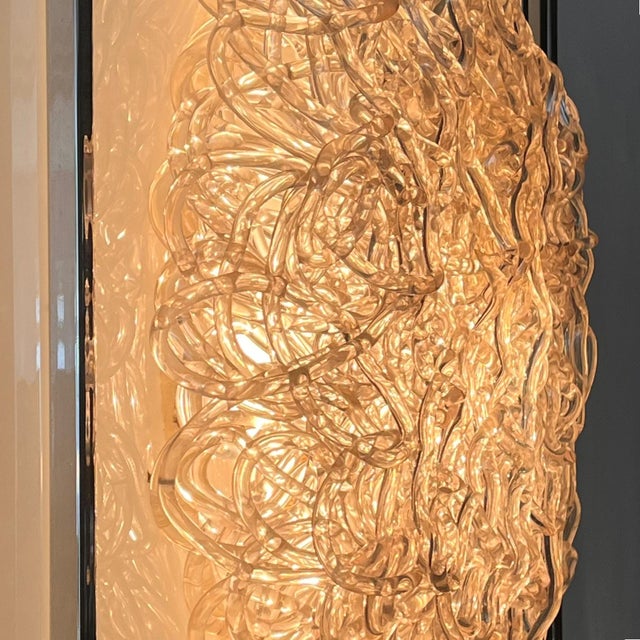 A rare and sophisticated wall lamp or light panel, produced in Italy by the Nucleo Forme design collective in the 1980s....