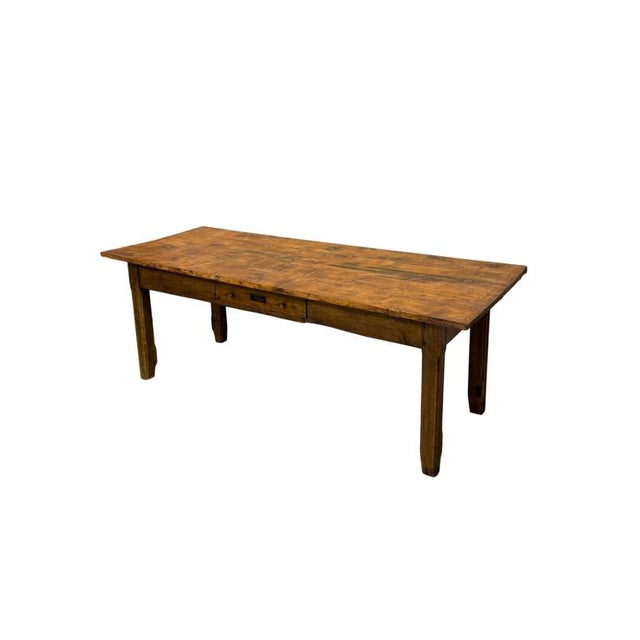 This impressive rustic table dates back to the late 19th century, crafted from fir and chestnut wood and featuring a...