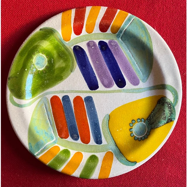 Set 4 Mid-Century Modern hand painted Italian pottery plates by Desimone, circa 1960's. Each plate decorated with stylized...
