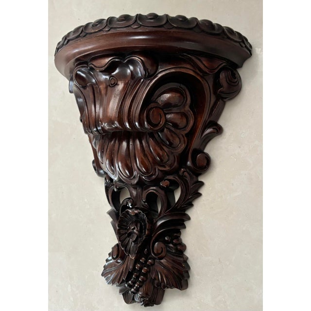 Intricately carved Victorian Revival wall shelf bracket with heavy scroll-work details with Baroque and Rococo influences....