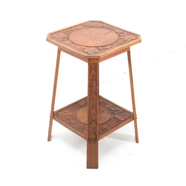 Stunning and rare Art Nouveau Arts & Crafts side table. Striking Dutch design from the 1900s. Solid oak frame with hand-...