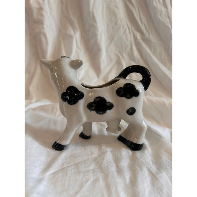 Kitschy mid 20th glazed ceramic cow bud vase. Made in Japan. Excellent vintage condition and nostalgic style.