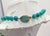 1960s goldtone single strand faux-jade spherical beads hand knoted with carved oval faux-jade box clasp. Marked "JOSEPH...